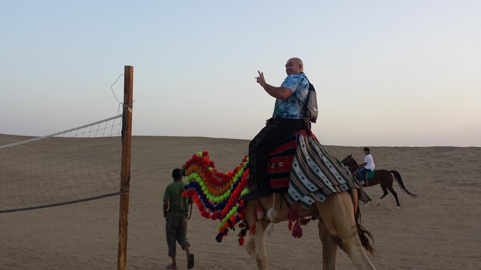 MXC Riding a Camel in the Saudi Desert